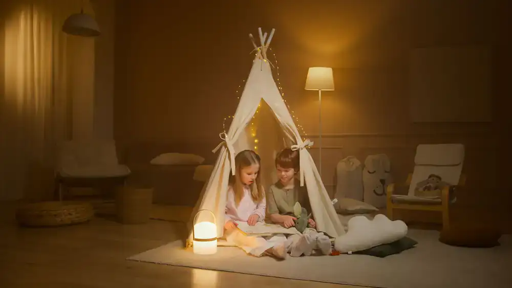 Children sitting on colorful cushions listening to a story