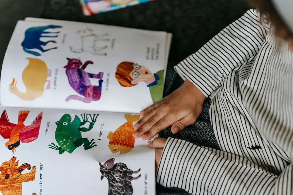 Child reading a colorful picture book